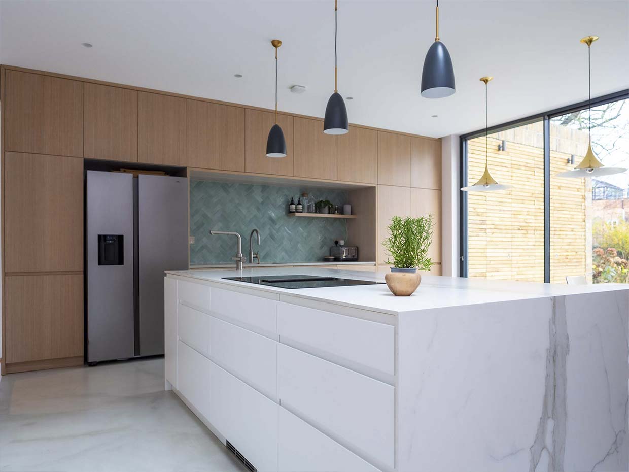 Image of a marble bespoke kitchen in London with an Island