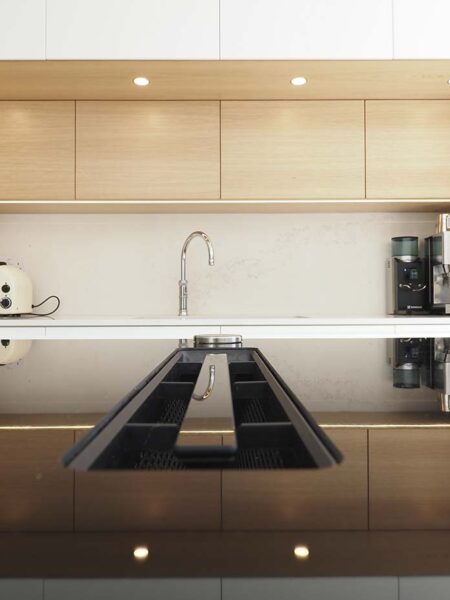 Image of a bespoke kitchen in London with a coffee machine and toaster