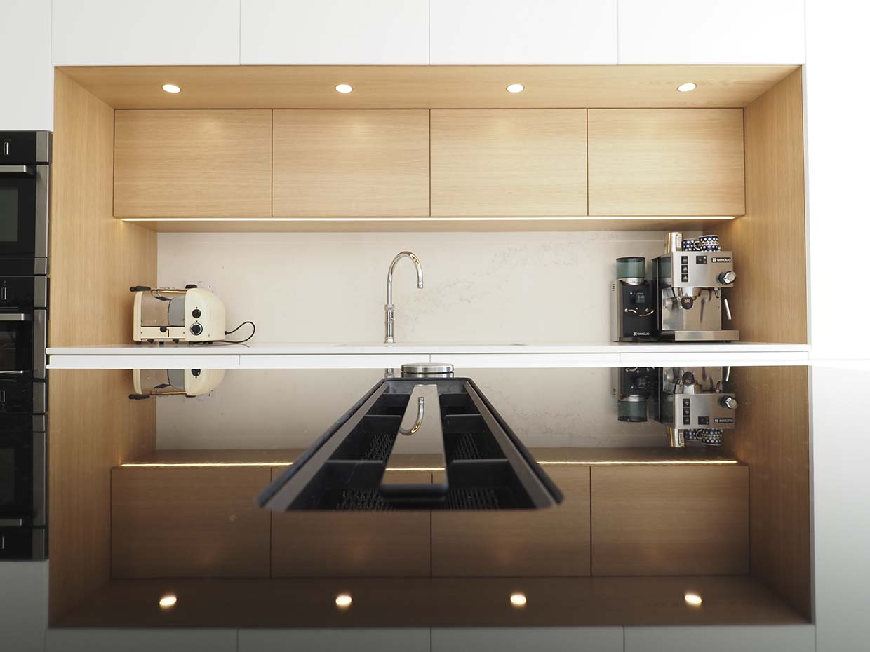 Image of a bespoke kitchen in London with a coffee machine and toaster